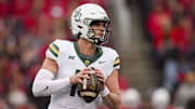 Oct 25, 2025; Cincinnati, Ohio, USA;  Baylor Bears quarterback Sawyer Robertson (13) drops back to pass against the Cincinnati Bearcats in the first half at Nippert Stadium. Mandatory Credit: Aaron Doster-Imagn Images