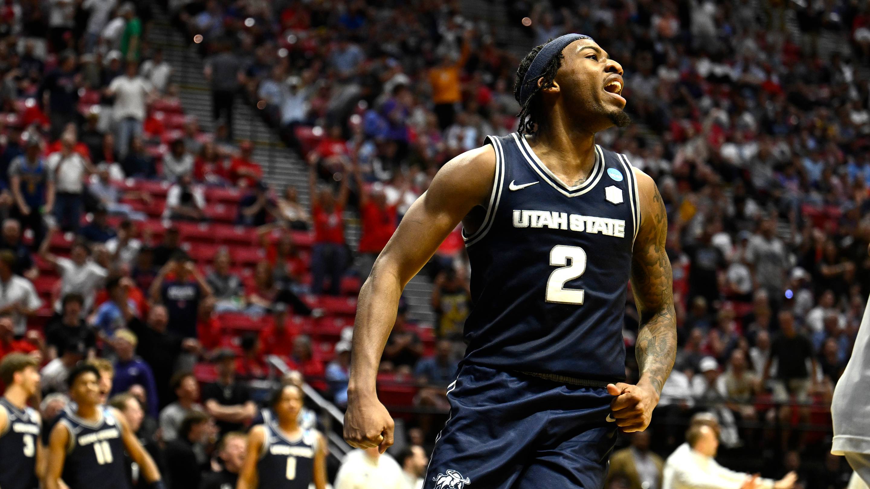 Mar 20, 2026; San Diego, CA, USA; Utah State Aggies guard Mj Collins (2) reacts in the second half against the Villanova Wildcats during a first round game of the men's 2026 NCAA Tournament at Viejas Arena. Mandatory Credit: Denis Poroy-Imagn Images | IMAGN IMAGES via Reuters Connect