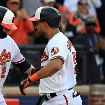 Baltimore Orioles designated hitter Anthony Santander (right) celebrates with shortstop Gunnar Henderson (2) after hitting a home run in the playoffs a year ago.