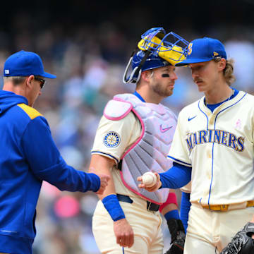 Seattle Mariners manager Dan Wilson (6) pulls Seattle Mariners starting pitcher Bryce Miller (50) from the game during the sixth inning against the Toronto Blue Jays at T-Mobile Park on May 11.