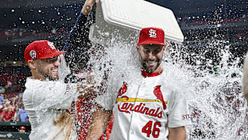 Sep 11, 2024; St. Louis, Missouri, USA;  St. Louis Cardinals first baseman Paul Goldschmidt (46) is doused with water by center fielder Michael Siani (63) and teammates after hitting the go ahead one run double in the eighth inning in a victory over the Cincinnati Reds at Busch Stadium. Mandatory Credit: Jeff Curry-Imagn Images