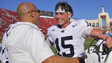 Penn State Nittany Lions quarterback Drew Allar is congratulated by head coach James Franklin