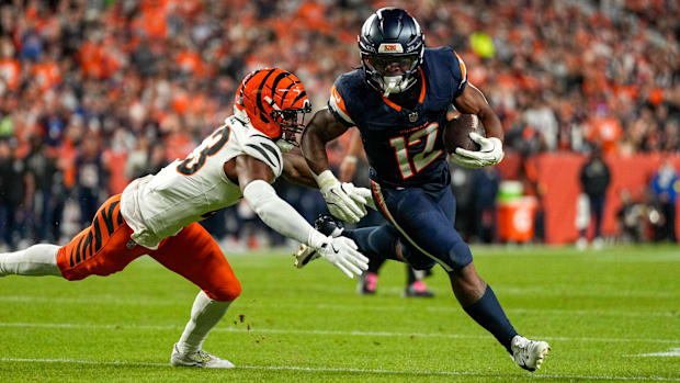 Denver Broncos running back RJ Harvey (12) runs the ball vs. the Cincinnati Bengals. 
