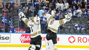 Apr 27, 2024; Toronto, Ontario, CAN; Boston Bruins goaltenders Jeremy Swayman (1) and Linus Ullmark (35) celebrate the win against the Toronto Maple Leafs at the end of the third period in game four of the first round of the 2024 Stanley Cup Playoffs at Scotiabank Arena. Mandatory Credit: Nick Turchiaro-USA TODAY 