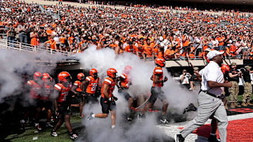 Oklahoma State runs on to the field before the college football game between the Oklahoma State Cowboys and the Baylor Bears at Boone Pickens Stadium in Stillwater, Okla., Saturday, Sept. 27, 2025.