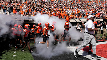 Oklahoma State runs on to the field before the college football game between the Oklahoma State Cowboys and the Baylor Bears at Boone Pickens Stadium in Stillwater, Okla., Saturday, Sept. 27, 2025.
