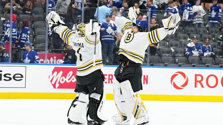 Apr 27, 2024; Toronto, Ontario, CAN; Boston Bruins goaltenders Jeremy Swayman (1) and Linus Ullmark (35) celebrate the win against the Toronto Maple Leafs at the end of the third period in game four of the first round of the 2024 Stanley Cup Playoffs at Scotiabank Arena. Mandatory Credit: Nick Turchiaro-USA TODAY 