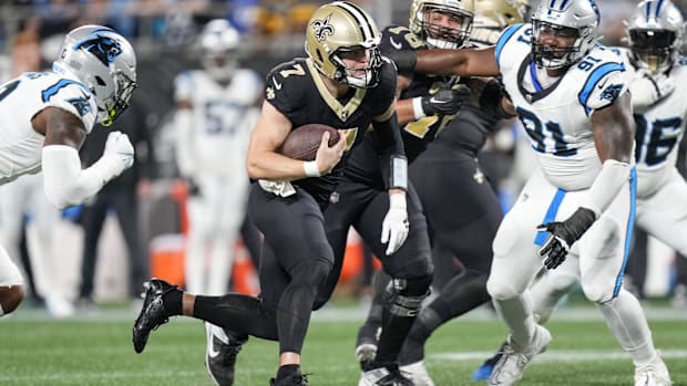 New Orleans Saints quarterback Taysom Hill (7) runs for yardage against the Carolina Panthers 