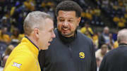 Nov 13, 2025; Morgantown, West Virginia, USA; Pittsburgh Panthers head coach Jeff Capel III talks to West Virginia Mountaineers head coach Ross Hodge before the game at WVU Coliseum. Mandatory Credit: Ben Queen-Imagn Images