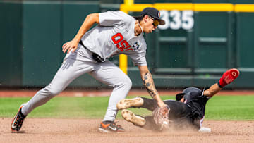 Jun 17, 2025; Omaha, Neb, USA; Louisville Cardinals shortstop Alex Alicea (0) steals second. Mandatory Credit: Dylan Widger-Imagn Images