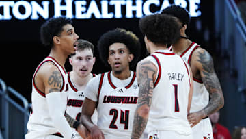 Louisville huddled during their game against Pitt at the KFC Yum! Center in Louisville, Ky. on Mar. 1, 2025.