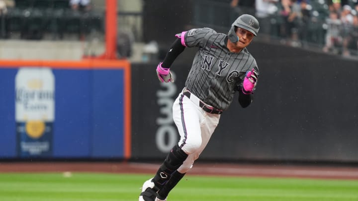 Aug 17, 2024; New York City, New York, USA; New York Mets left fielder Brandon Nimmo (9) rounds second base during the game against the Miami Marlins at Citi Field. Mandatory Credit: Lucas Boland-USA TODAY Sports