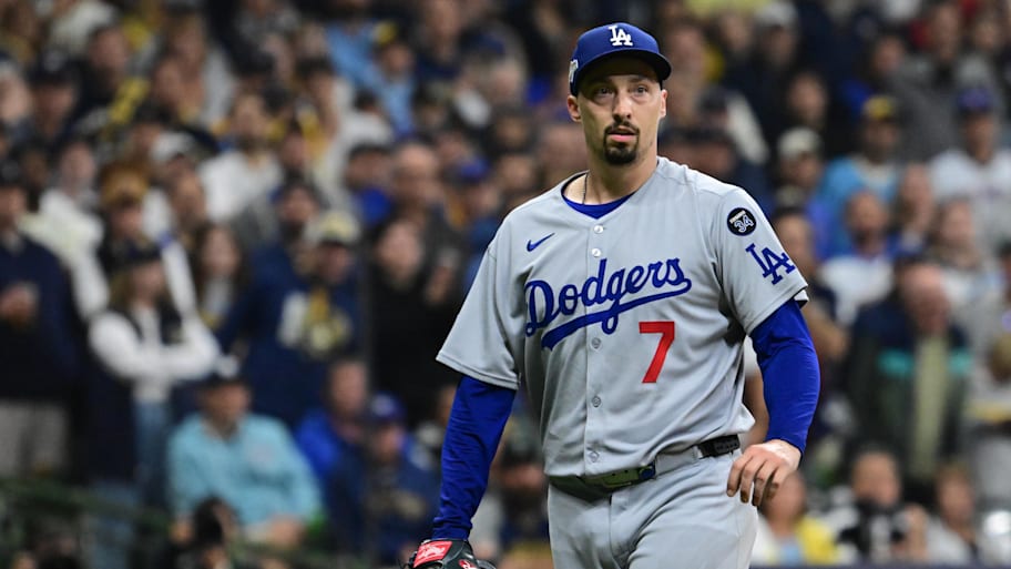 Los Angeles Dodgers starting pitcher Blake Snell (7) walks back to the dugout.