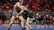 Assumption Davenport's Steele Diercks wrestles Oskaloosa's Kaiden Parker at 132 lbs during the Iowa high school boys state wrestling tournament on Thursday, Feb. 20, 2025, at Wells Fargo Arena in Des Moines.