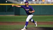 Jun 22, 2023; Omaha, NE, USA;  LSU Tigers starting pitcher Paul Skenes (20) throws against the Wake Forest Demon Deacons in the first inning at Charles Schwab Field Omaha. Mandatory Credit: Steven Branscombe-Imagn Images