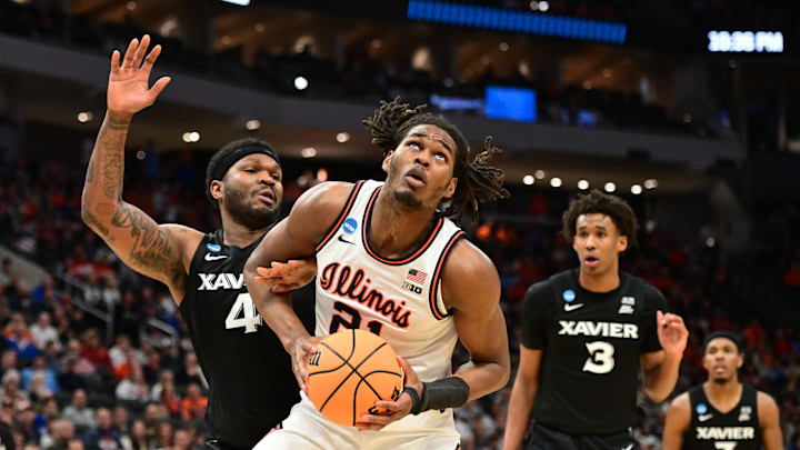 Mar 21, 2025; Milwaukee, WI, USA: Illinois Fighting Illini forward Morez Johnson Jr. (21) drives to the hoop past Xavier Musketeers forward John Hugley IV (4) during the second half at Fiserv Forum. Mandatory Credit: Benny Sieu-Imagn Images