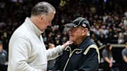 Purdue Boilermakers head coach Matt Painter shakes hands with former coach Gene Keady 