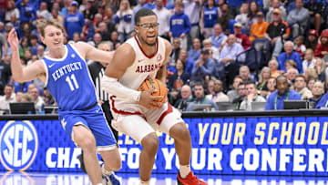 Mar 14, 2025; Nashville, TN, USA;  Alabama Crimson Tide guard Chris Youngblood (8) drives to the basket against the Kentucky Wildcats during the first half at Bridgestone Arena. Mandatory Credit: Steve Roberts-Imagn Images