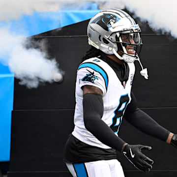 Dec 15, 2024; Charlotte, North Carolina, USA;  Carolina Panthers cornerback Jaycee Horn (8) runs on to the field before the game at Bank of America Stadium. Mandatory Credit: Bob Donnan-Imagn Images