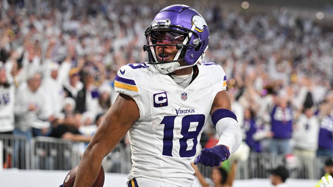 Dec 24, 2023; Minneapolis, Minnesota, USA; Minnesota Vikings wide receiver Justin Jefferson (18) reacts after scoring a touchdown during the second quarter against the Detroit Lions at U.S. Bank Stadium. Mandatory Credit: Jeffrey Becker-USA TODAY Sports