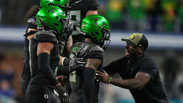 Oregon Ducks defensive back Nikko Reed (9) celebrates an interception Sunday, Dec. 8, 2024, during the Big Ten Championship game at Lucas Oil Stadium in Indianapolis. The Oregon Ducks defeated the Penn State Nittany Lions, 45-37.