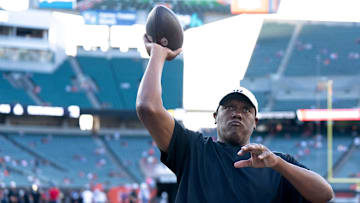 Cincinnati Bengals defensive line coach Marion Hobby throws a ball with fans before NFL preseason game between the Cincinnati Bengals and the Indianapolis Colts at Paycor Stadium in Cincinnati on Thursday, Aug. 22, 2024.