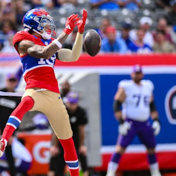 Sep 8, 2024; East Rutherford, New Jersey, USA; New York Giants wide receiver Jalin Hyatt (13) is unable to catch a pass as Minnesota Vikings linebacker Blake Cashman (51) pursues during the second half at MetLife Stadium.  