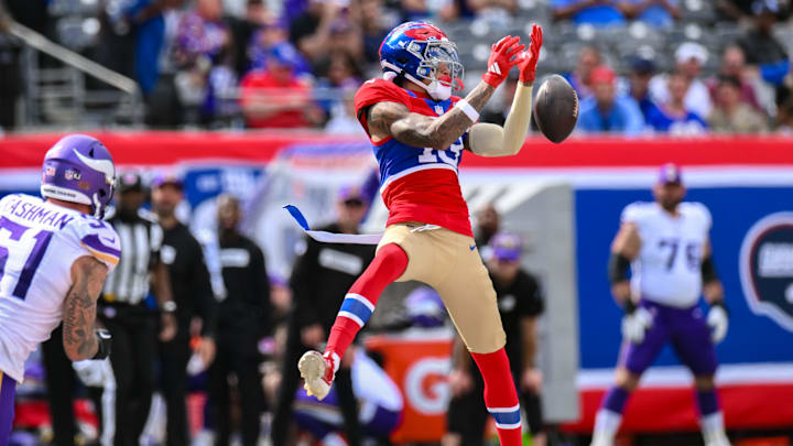 Sep 8, 2024; East Rutherford, New Jersey, USA; New York Giants wide receiver Jalin Hyatt (13) is unable to catch a pass as Minnesota Vikings linebacker Blake Cashman (51) pursues during the second half at MetLife Stadium.  