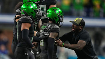 Oregon Ducks defensive back Nikko Reed (9) celebrates an interception Sunday, Dec. 8, 2024, during the Big Ten Championship game at Lucas Oil Stadium in Indianapolis. The Oregon Ducks defeated the Penn State Nittany Lions, 45-37.