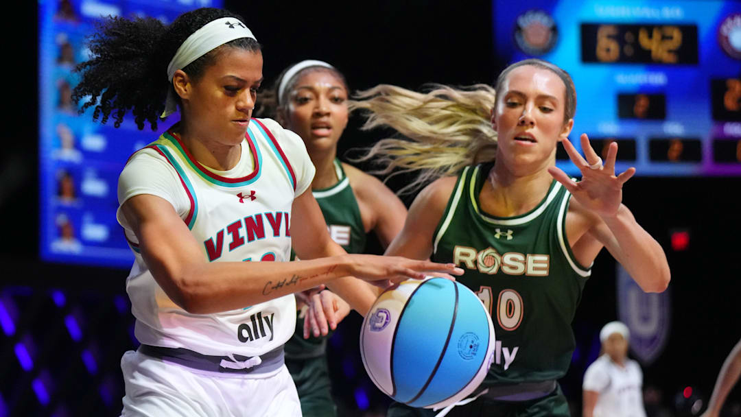 Jan 17, 2025; Miami, FL, USA; Rae Burrell (12) of the Vinyl  battles for possession with Lexie Hull (10) and Angel Reese (5) of the Rose in the first half of the Unrivaled women’s professional 3v3 basketball league at Wayfair Arena. Mandatory Credit: Jim Rassol-Imagn Images