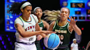 Jan 17, 2025; Miami, FL, USA; Rae Burrell (12) of the Vinyl  battles for possession with Lexie Hull (10) and Angel Reese (5) of the Rose in the first half of the Unrivaled women’s professional 3v3 basketball league at Wayfair Arena. Mandatory Credit: Jim Rassol-Imagn Images