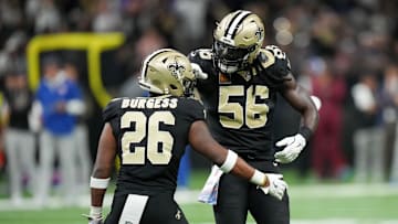 Oct 5, 2025; New Orleans, Louisiana, USA; New Orleans Saints safety Terrell Burgess (26) and New Orleans Saints outside linebacker Demario Davis (56) celebrate a pass break up against the New York Giants during the second quarter at Caesars Superdome. Mandatory Credit: Matthew Hinton-Imagn Images