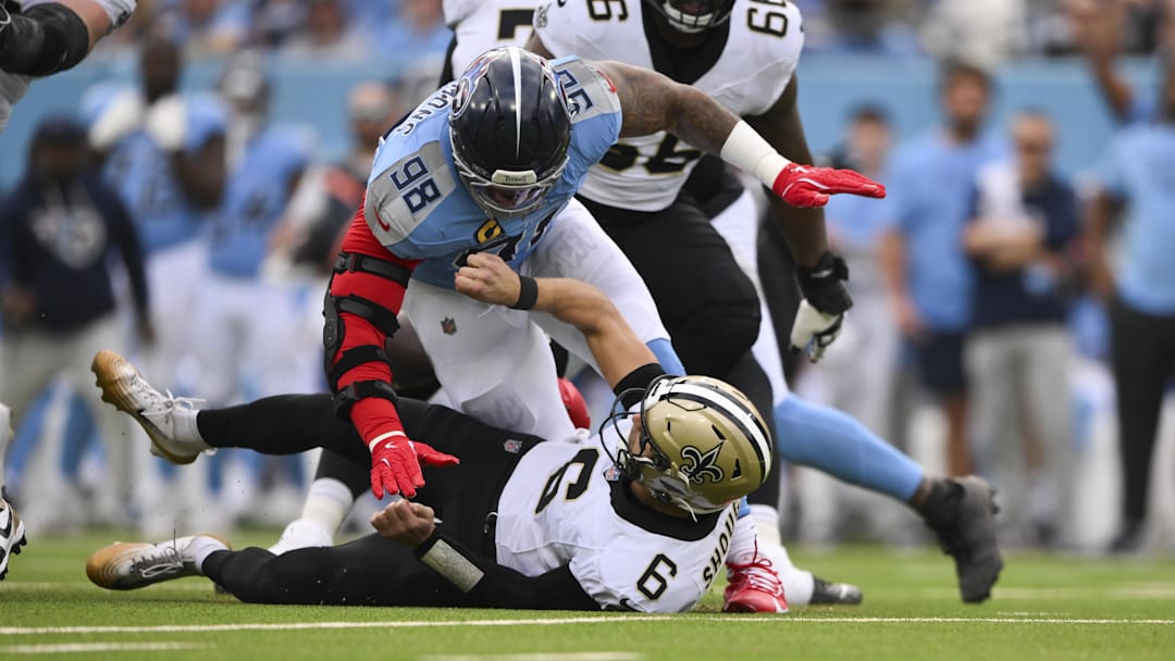 Dec 28, 2025; Nashville, Tennessee, USA;  Tennessee Titans defensive tackle Jeffery Simmons (98) sacks New Orleans Saints quarterback Tyler Shough (6) forcing a fumble during the first quarter of the game at Nissan Stadium. Mandatory Credit: Steve Roberts-Imagn Images