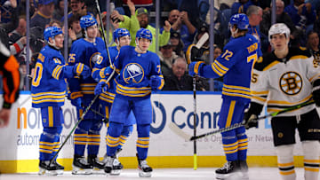 Jan 28, 2025; Buffalo, New York, USA;  Buffalo Sabres right wing JJ Peterka (77) celebrates his goal with teammates during the third period against the Boston Bruins at KeyBank Center. Mandatory Credit: Timothy T. Ludwig-Imagn Images