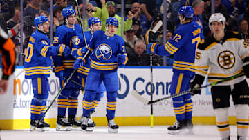 Jan 28, 2025; Buffalo, New York, USA;  Buffalo Sabres right wing JJ Peterka (77) celebrates his goal with teammates during the third period against the Boston Bruins at KeyBank Center. Mandatory Credit: Timothy T. Ludwig-Imagn Images