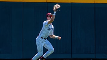Jun 23, 2024; Omaha, NE, USA; Texas A&M Aggies left fielder Caden Sorrell (13) makes a catch against the Tennessee Volunteers during the first inning at Charles Schwab Field Omaha. Mandatory Credit: Dylan Widger-Imagn Images