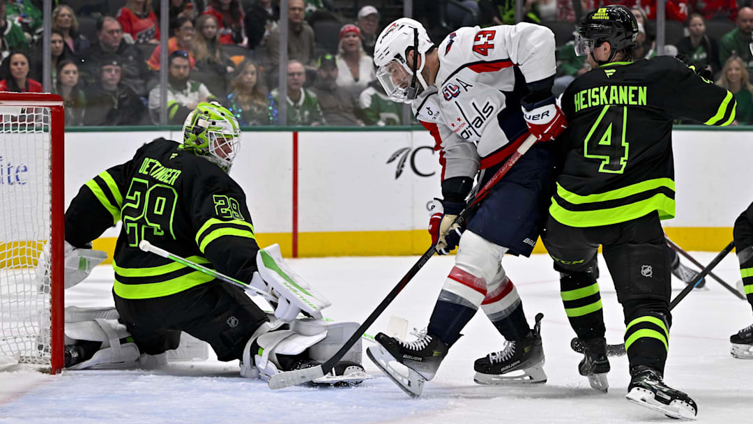 Dec 16, 2024; Dallas, Texas, USA; Dallas Stars goaltender Jake Oettinger (29) and defenseman Miro Heiskanen (4) and Washington Capitals right wing Tom Wilson (43) in action during the game between the Dallas Stars and the Washington Capitals at American Airlines Center. Mandatory Credit: Jerome Miron-Imagn Images