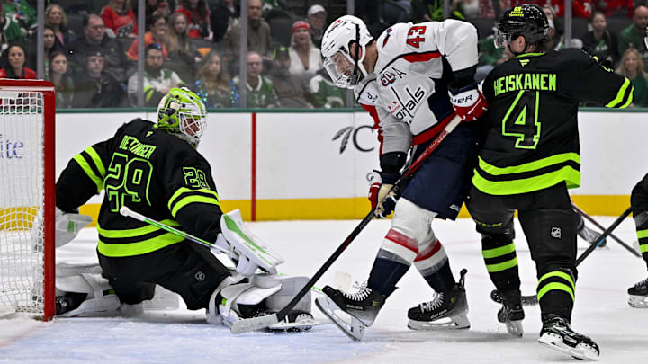 Dec 16, 2024; Dallas, Texas, USA; Dallas Stars goaltender Jake Oettinger (29) and defenseman Miro Heiskanen (4) and Washington Capitals right wing Tom Wilson (43) in action during the game between the Dallas Stars and the Washington Capitals at American Airlines Center. Mandatory Credit: Jerome Miron-Imagn Images