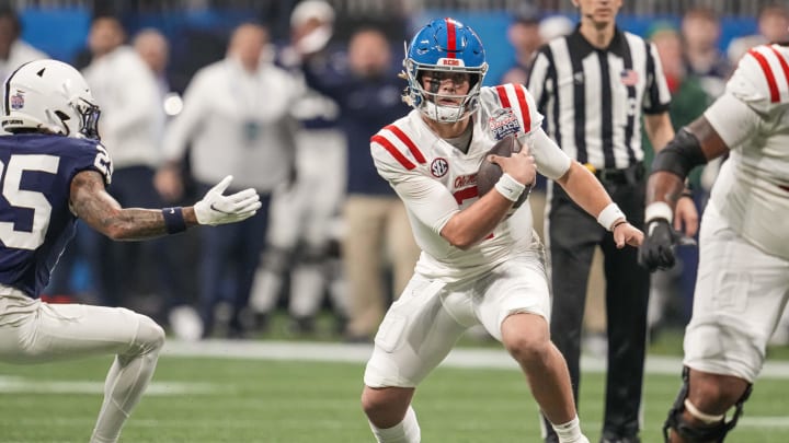 Dec 30, 2023; Atlanta, GA, USA; Mississippi Rebels quarterback Jaxson Dart (2) runs with the ball against the Penn State Nittany Lions during the first half at Mercedes-Benz Stadium. Mandatory Credit: Dale Zanine-USA TODAY Sports