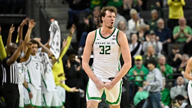 Feb 16, 2025; Eugene, Oregon, USA; Oregon Ducks center Nate Bittle (32) reacts to a made three point shot against the Rutgers