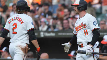 Jun 27, 2024; Baltimore, Maryland, USA; Baltimore Orioles shortstop Gunnar Henderson (2) greeted by third baseman Jordan Westburg (11) after scoring in the first inning against the Texas Rangers at Oriole Park at Camden Yards. Mandatory Credit: Mitch Stringer-USA TODAY Sports