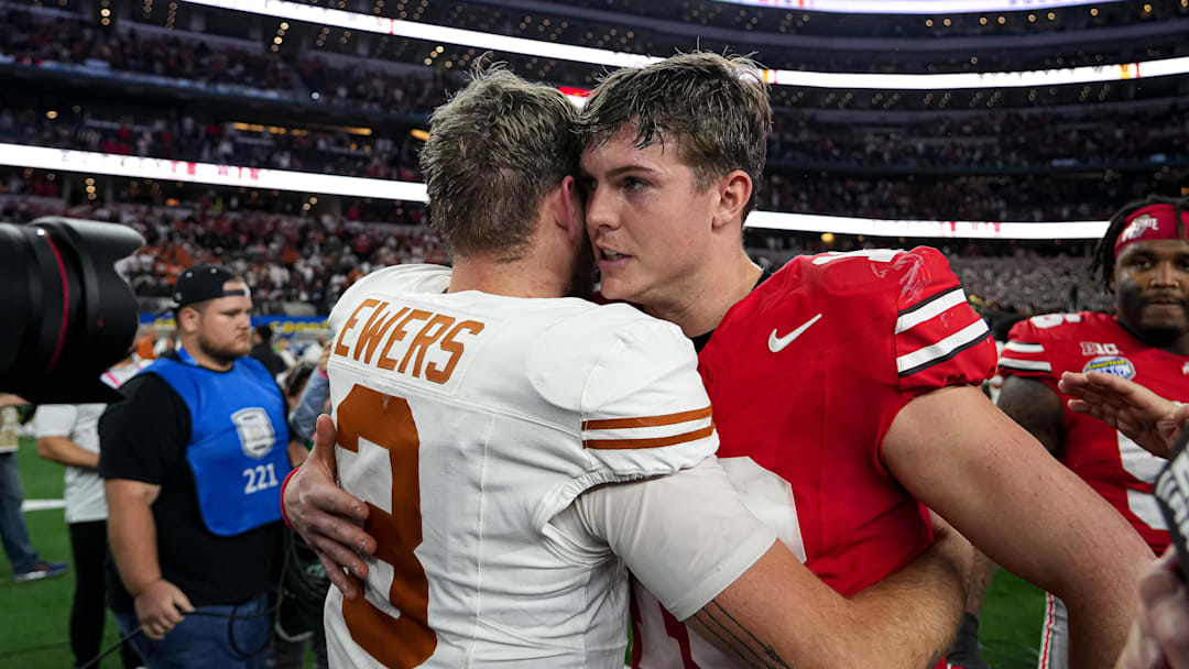 Ohio State quarterback Will Howard (18) meets Texas Longhorns quarterback Quinn Ewers (3) after the College Football Playoff semifinal game in the Cotton Bowl at AT&T Stadium on Friday, Jan. 10, 2024 in Arlington, Texas. Ohio State beat Texas 28-14 to advance to the National Championship.