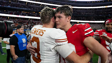 Ohio State quarterback Will Howard (18) meets Texas Longhorns quarterback Quinn Ewers (3) after the College Football Playoff semifinal game in the Cotton Bowl at AT&T Stadium on Friday, Jan. 10, 2024 in Arlington, Texas. Ohio State beat Texas 28-14 to advance to the National Championship.