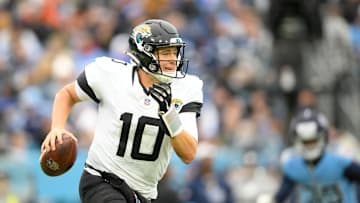 Dec 8, 2024; Nashville, Tennessee, USA;   Jacksonville Jaguars quarterback Mac Jones (10) gets flushed from the pocket against the Tennessee Titans during the second half at Nissan Stadium. Mandatory Credit: Steve Roberts-Imagn Images