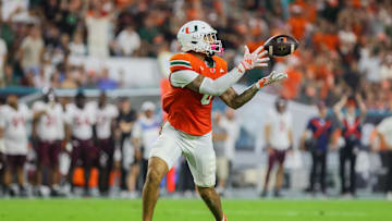 Sep 27, 2024; Miami Gardens, Florida, USA; Miami Hurricanes tight end Elijah Arroyo (8) catches the football for a touchdown against the Virginia Tech Hokies during the first quarter at Hard Rock Stadium. Mandatory Credit: Sam Navarro-Imagn Images