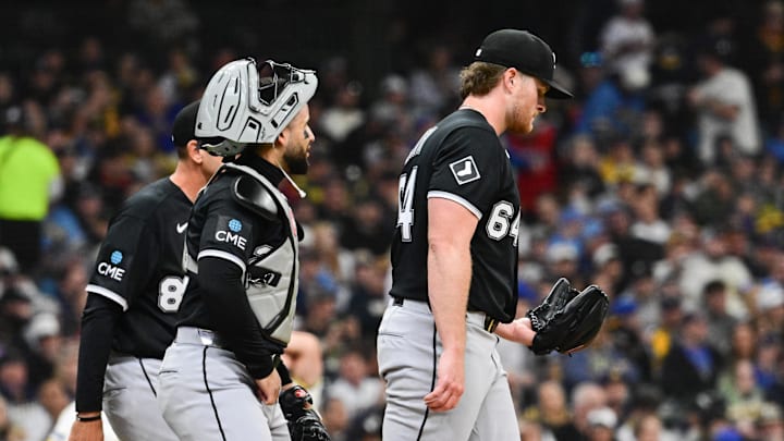 Mar 26, 2026; Milwaukee, Wisconsin, USA; Chicago White Sox starting pitcher Shane Smith (64) gets a mound visit in the second inning against the Milwaukee Brewers at American Family Field. Mandatory Credit: Benny Sieu-Imagn Images