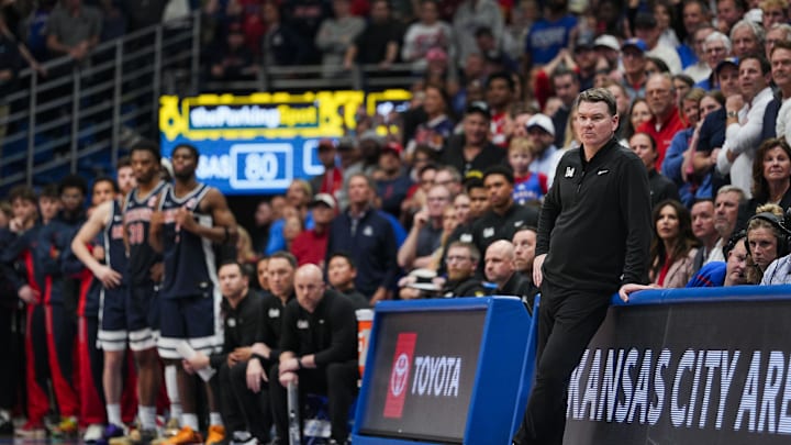 Feb 7, 2026; Lawrence, Kansas, USA; Arizona Wildcats head coach Tommy Lloyd watches the action during the second half against the Kansas Jayhawks at Allen Fieldhouse. Mandatory Credit: Jay Biggerstaff-Imagn Images