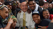 Nov 29, 2012; South Bend, IN, USA; ESPN analyst Dick Vitale poses for photos with members of the Notre Dame Fighting Irish football team before the basketball game between Notre Dame and the Kentucky Wildcats at the Purcell Pavilion. Notre Dame won 64-50. 
