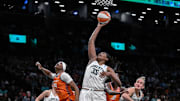 Aug 25, 2025; Brooklyn, New York, USA; New York Liberty center Jonquel Jones (35) rebounds the ball against Connecticut Sun forward Aneesah Morrow (24) during the second half at Barclays Center. 
