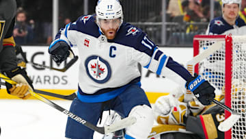 Apr 3, 2025; Las Vegas, Nevada, USA; Winnipeg Jets center Adam Lowry (17) celebrates after scoring a goal against the Vegas Golden Knights during the first period at T-Mobile Arena. Mandatory Credit: Stephen R. Sylvanie-Imagn Images